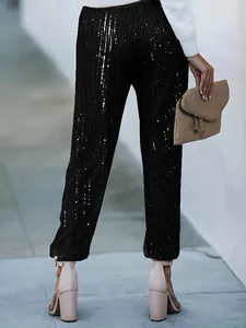 Eleganti pantaloni neri a paillettes a gamba dritta da donna, dettaglio da sera