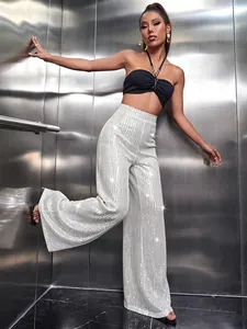 Close-up of sparkling silver sequined wide-leg pants with elegant high-waist drape