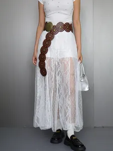 Detailed look at the white lace sheer long skirt featuring elegant floral perspective patterns.