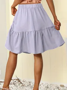 Detailed back view of a lavender tiered ruffle short skirt showing soft fabric drape