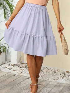 Detail shot of light purple pleated summer skirt with ruffle hem and elastic waist.