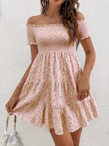 Detail of floral off-the-shoulder dress with smocked bodice and tiered skirt