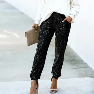 Eleganti pantaloni jogger da donna con paillettes nere e coulisse in vita per feste