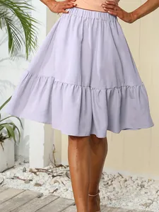 Close-up of a lavender ruffled mini skirt with soft pleated design for casual summer style