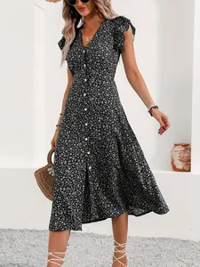 Detail view of floral v-neck midi dress with buttons and flutter sleeves.