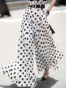 Elegant high-waist polka dot culottes featuring a breezy wide-leg design and belt