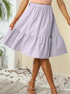 Detail of lavender pleated mini skirt with ruffled hem and elastic waist.