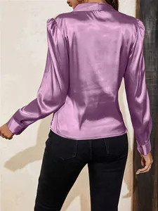 Detailed back view of a mauve satin blouse featuring elegant gathered lantern sleeves.