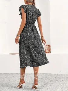 Detailed back view of a ditsy floral midi dress with cinched waist and flutter sleeves