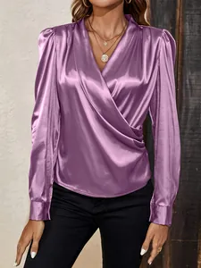 Detail view of a purple V-neck satin blouse with lantern sleeves and a glossy finish