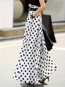 Close-up of high-waisted polka dot culottes with elegant flowing fabric and side profile view