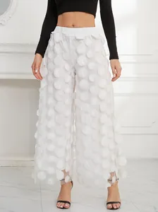 Elegant white wide-leg trousers featuring unique 3D mesh circular polka dot appliques for women.