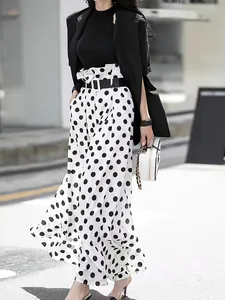Elegant high-waisted polka dot wide-leg trousers for a chic and flowing silhouette.