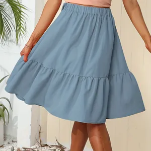 Stylish blue ruffled tiered midi skirt with elastic waist for summer leisure.