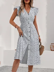 Detail of flutter sleeve V-neck midi dress featuring delicate floral print and front buttons