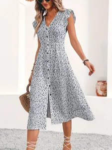 Floral V-neck midi dress with short sleeves and front buttons, styled with accessories.