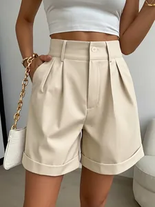 Close-up shot of beige high-waisted wide-leg faux leather shorts with cuffed hem