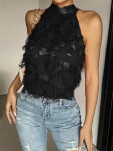 Close-up of elegant black sleeveless high-neck top with fringe texture details