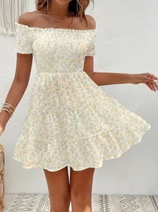Detailed macro view of women's vintage floral off-shoulder French mini dress with smocked bodice