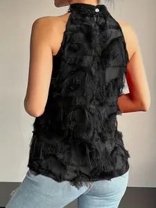 Back view detail showing intricate black fringe texture on sleeveless halter top