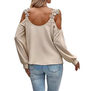 Elegant beige cold shoulder long sleeve blouse with floral crochet lace trim on straps