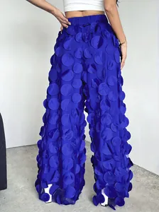 Detailed back view of women's blue mesh pants with unique 3D circular dot texture