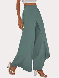 Detailed view of women's high-waisted wide-leg pants with elegant split hem design