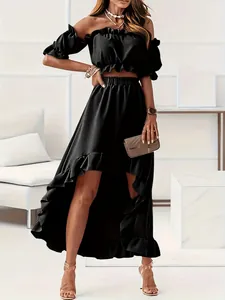 Elegant black two-piece set featuring off-shoulder ruffle top and high-low skirt.