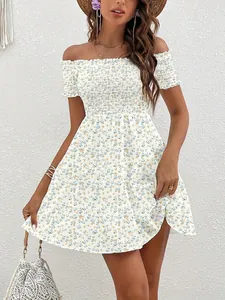 Detail of a French vintage floral off-the-shoulder smocked dress with sweet flower prints