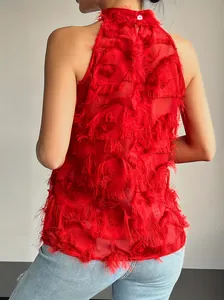 Detailed back view of a vibrant red sleeveless high-neck top with textured fringe.