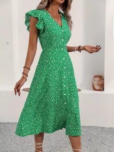 Detailed view of a green floral midi dress with V-neck and ruffle sleeves design