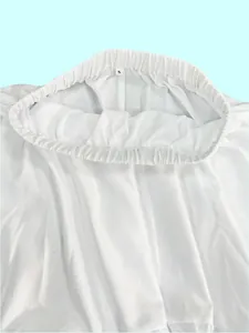 Detailed view of the elastic waistband and S-size tag on a white long swing skirt