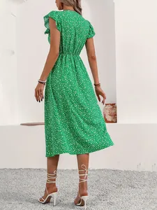 Back view of a green floral midi dress with short sleeves and an elastic waist