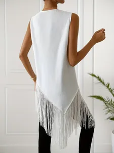 Back view detail of sleeveless ribbed knit top with irregular long tassel fringe hem