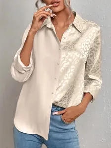 Close-up detail of dual-tone long sleeve shirt featuring cream satin and leopard print