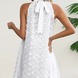 Elegant white sleeveless halter-neck dress featuring 3D butterfly appliqués and a bow tie back