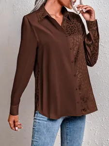 Close-up of elegant women's split blouse with leopard print and solid brown fabric