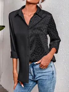 Detailed view of the leopard print and solid black patchwork design on this elegant shirt