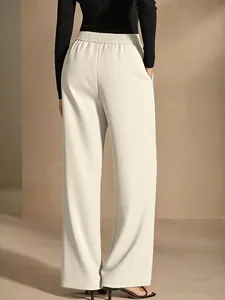 Back view of elegant cream wide-leg trousers featuring a high waist and draped design