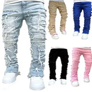 Detail showing various colors of distressed stacked denim jeans for women.