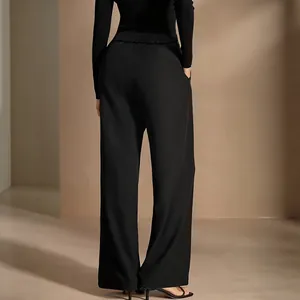 Elegant black high-waisted wide-leg trousers with a flowing draped fit for work