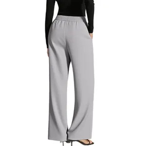Back view of high-waisted grey wide-leg trousers with an elastic waistband and pockets.