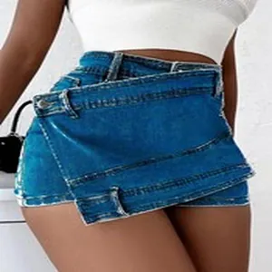 Detailed view of women's asymmetrical blue denim skort with creative wrap design