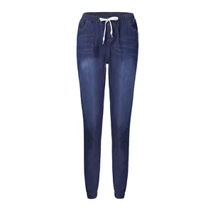 Full view of women's dark blue denim joggers featuring elastic waist and white drawstring