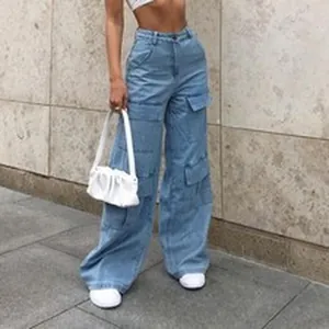Close-up of light blue wide-leg cargo jeans with multiple utility pockets
