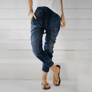 Loose fit blue denim harem pants for women with elastic drawstring waist detail