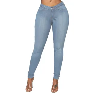 Detail view of light blue skinny denim jeans showing elastic fit and peach butt lifting.