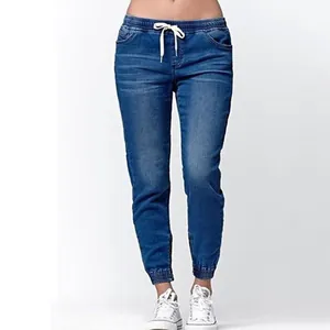 Women's blue denim jogger pants with elastic drawstring waist and cuffed ankles