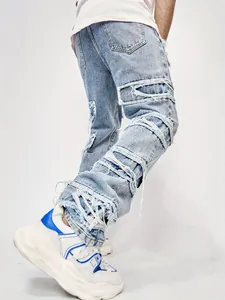 Detailed view of heavy distressing and frayed edges on light blue street style jeans