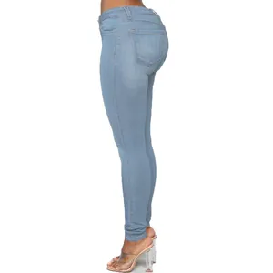 High waist slim fit light blue skinny jeans for women highlighting peach hip curve